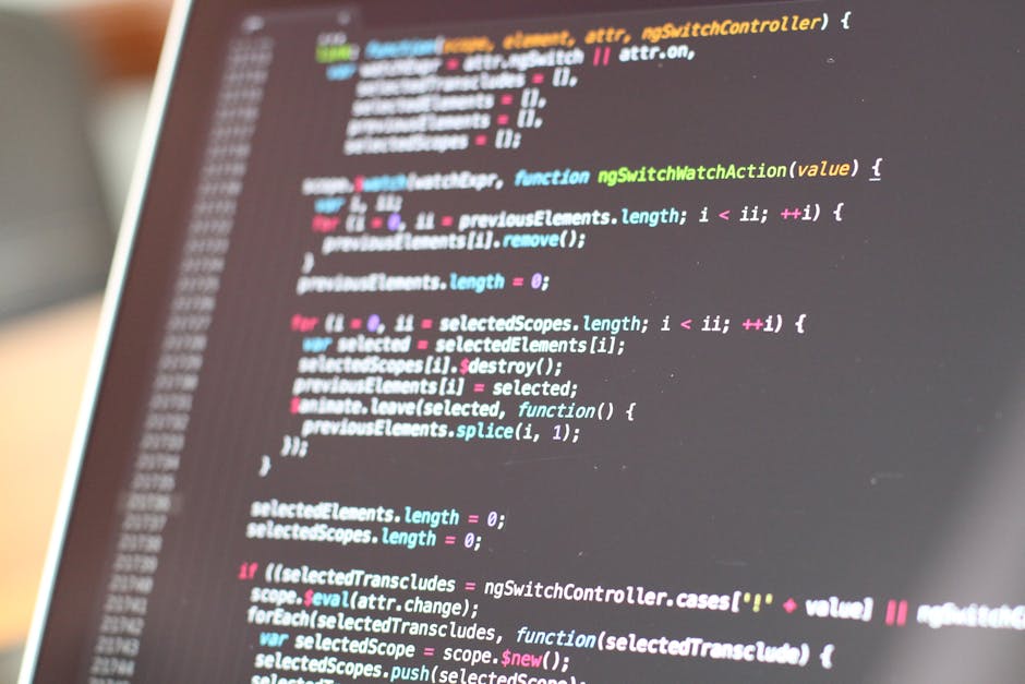 A close-up of a computer screen displaying lines of colorful code in a text editor, with a blurred background. The code consists of syntax-highlighted programming language, including keywords, variabl